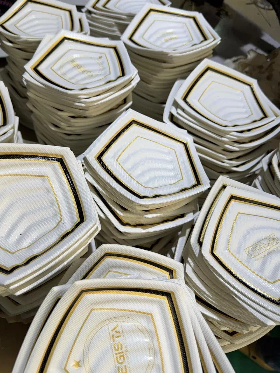 Prepared football panel pieces stacked at the factory