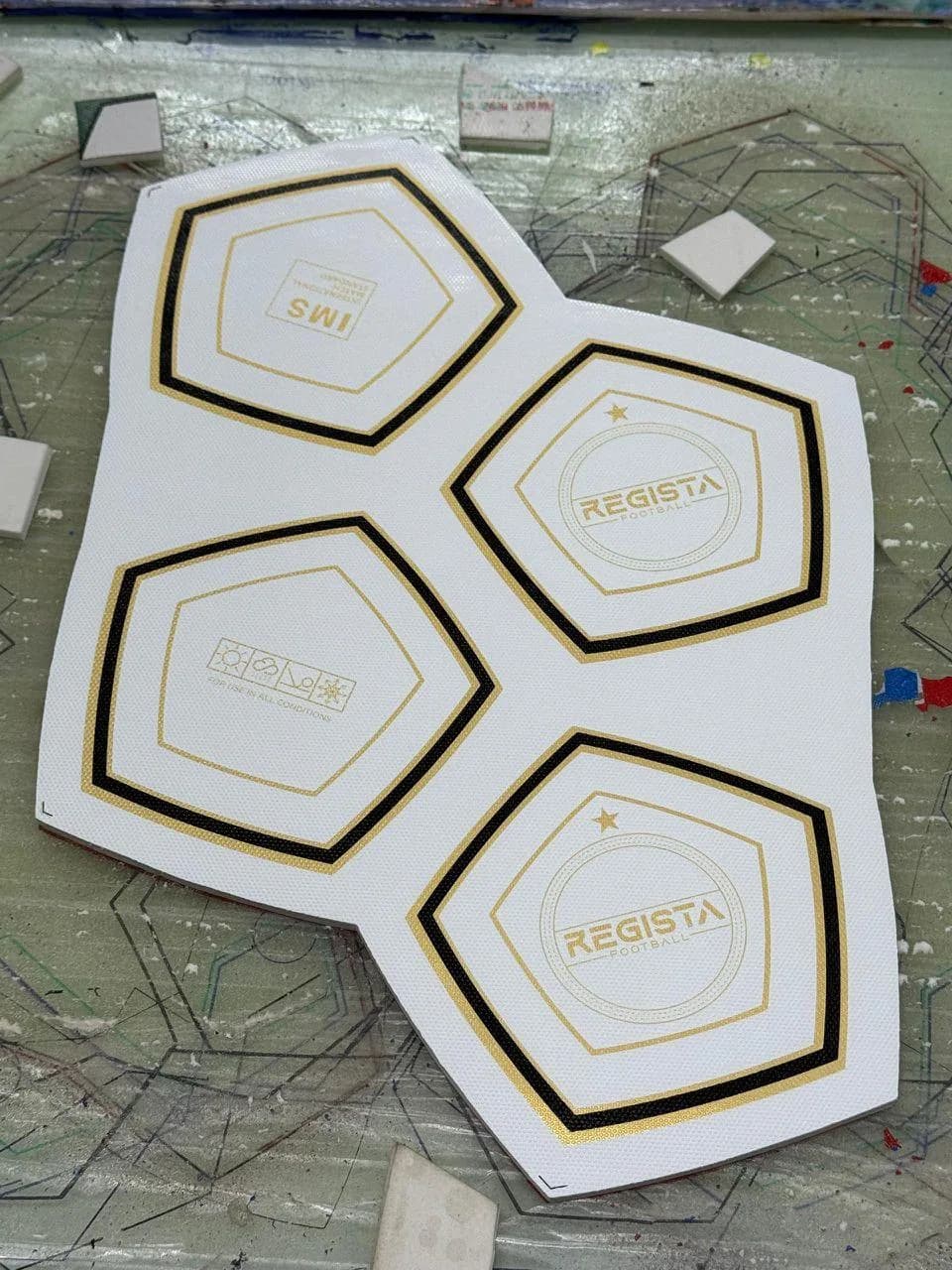 Printed Regista panel pieces arranged on a factory work surface